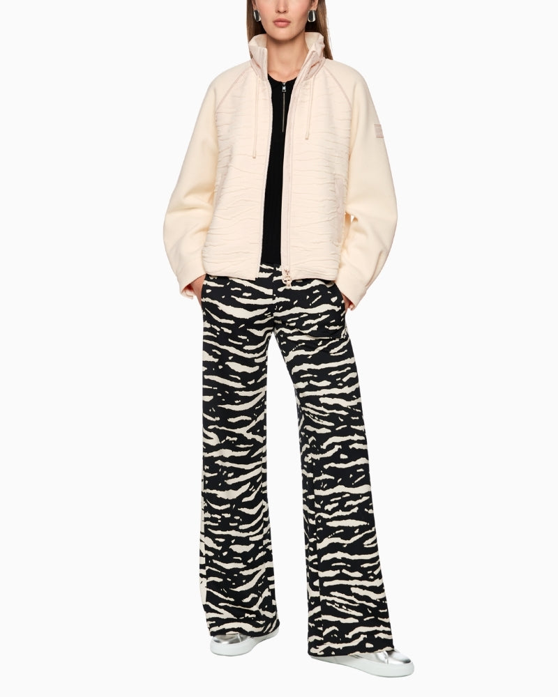 Cream statement jacket styled with jeans for a casual look