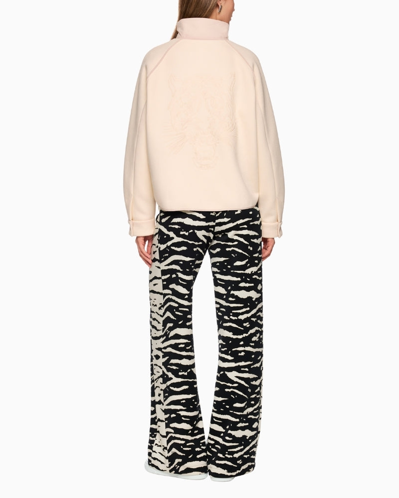 Back view of cream jacket with bold leopard head motif