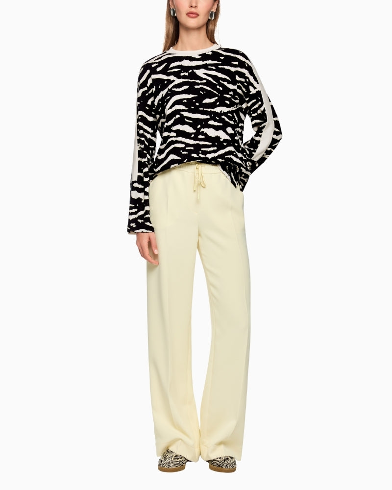 Marc Cain printed top styled with black jeans and boots