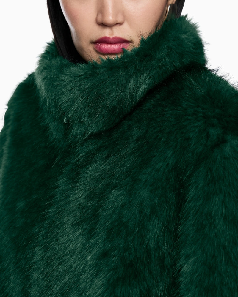 Close-up of long faux fur texture and stylish zip pull detail