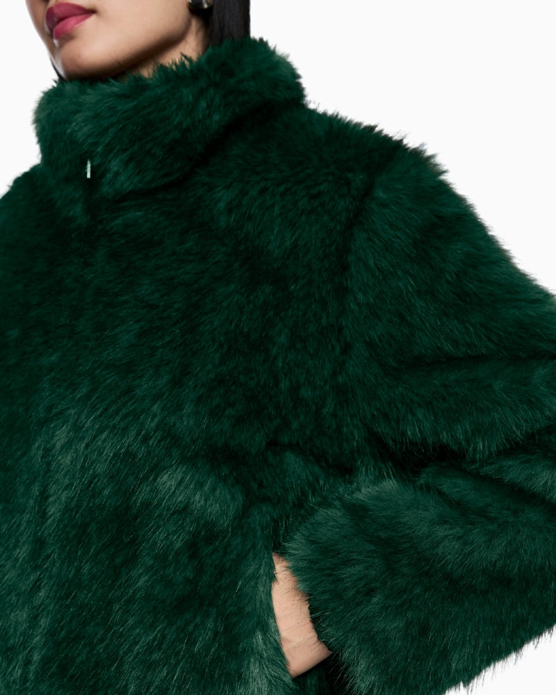 Close-up of long faux fur texture and stylish zip pull detail