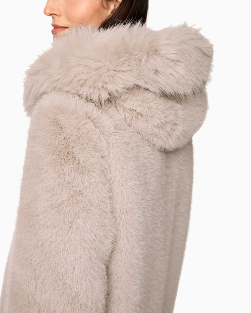 Close-up of soft faux fur texture and hood detail on Marc Cain coat