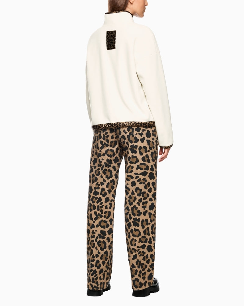 Back view showing zipped pocket and soft fleece texture