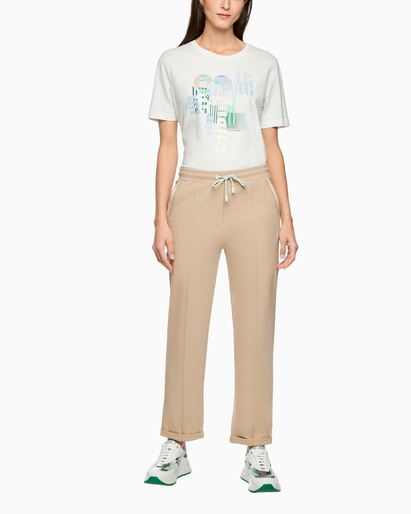 Woman wearing Marc Cain beige trousers full outfit front view – Áines Boutique