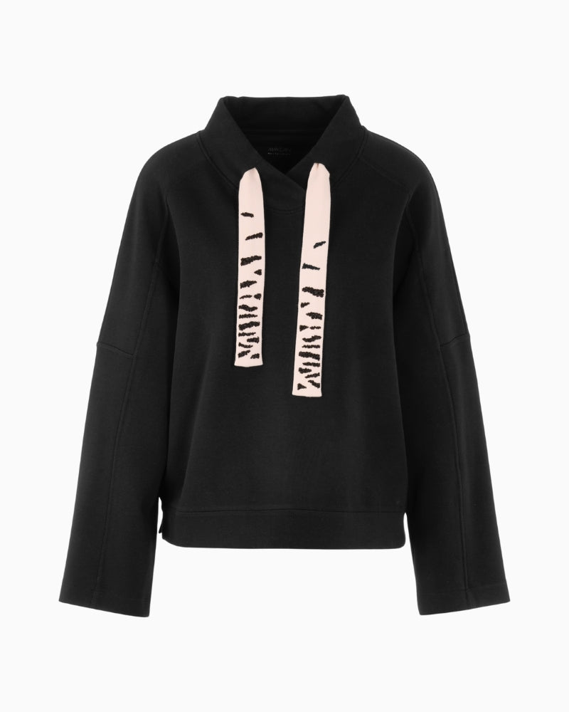 Front view of loose black jumper with wide sleeves and soft finish