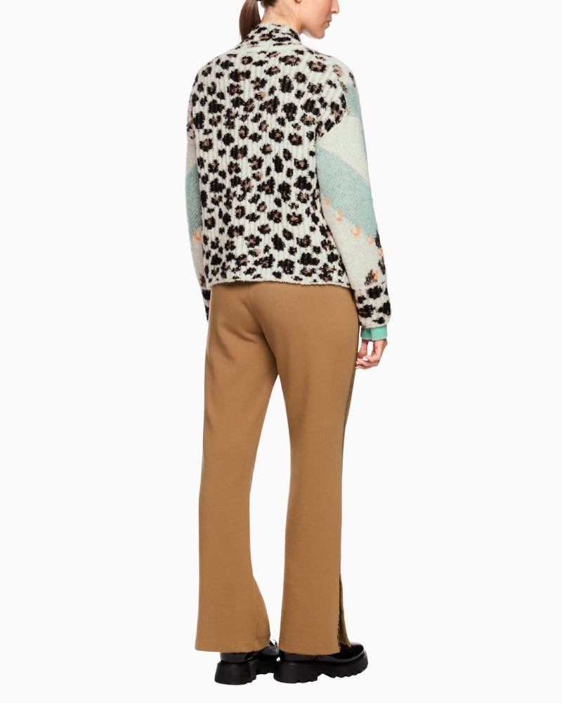 Back view of cardigan featuring full leopard knit panel