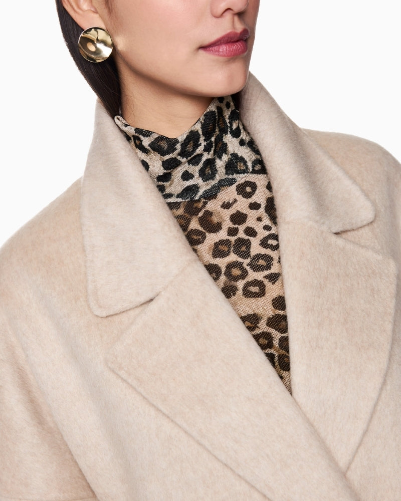 Close-up of high-quality wool and silk fabric with visible weave detail