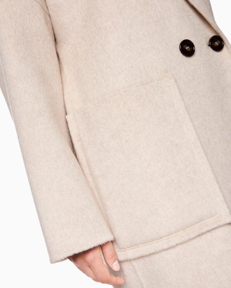 Close-up of high-quality wool and silk fabric with visible weave detail