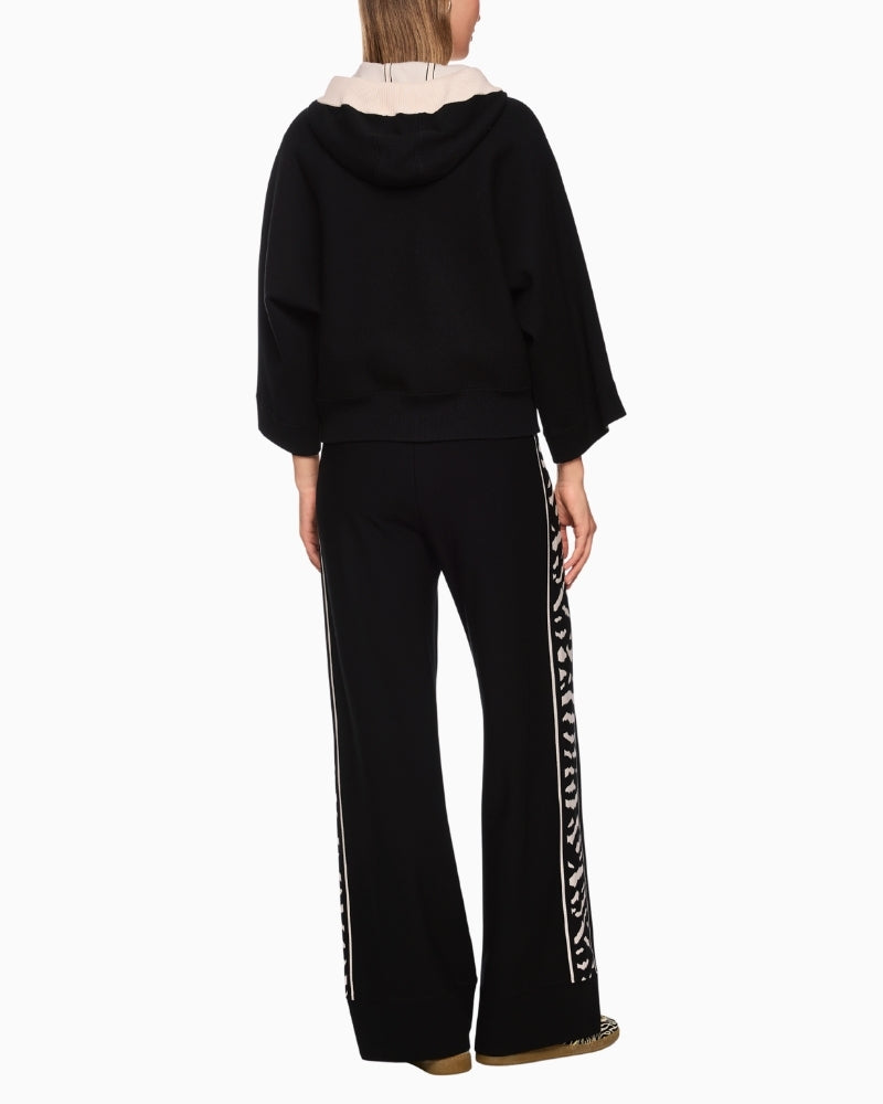 Back view of hooded cardigan with contrast stripe and animal print detail