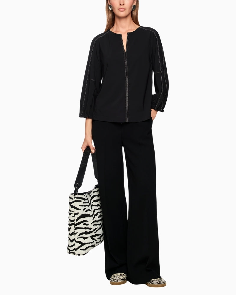 Marc Cain sporty blouse styled with wide-leg trousers for casual look