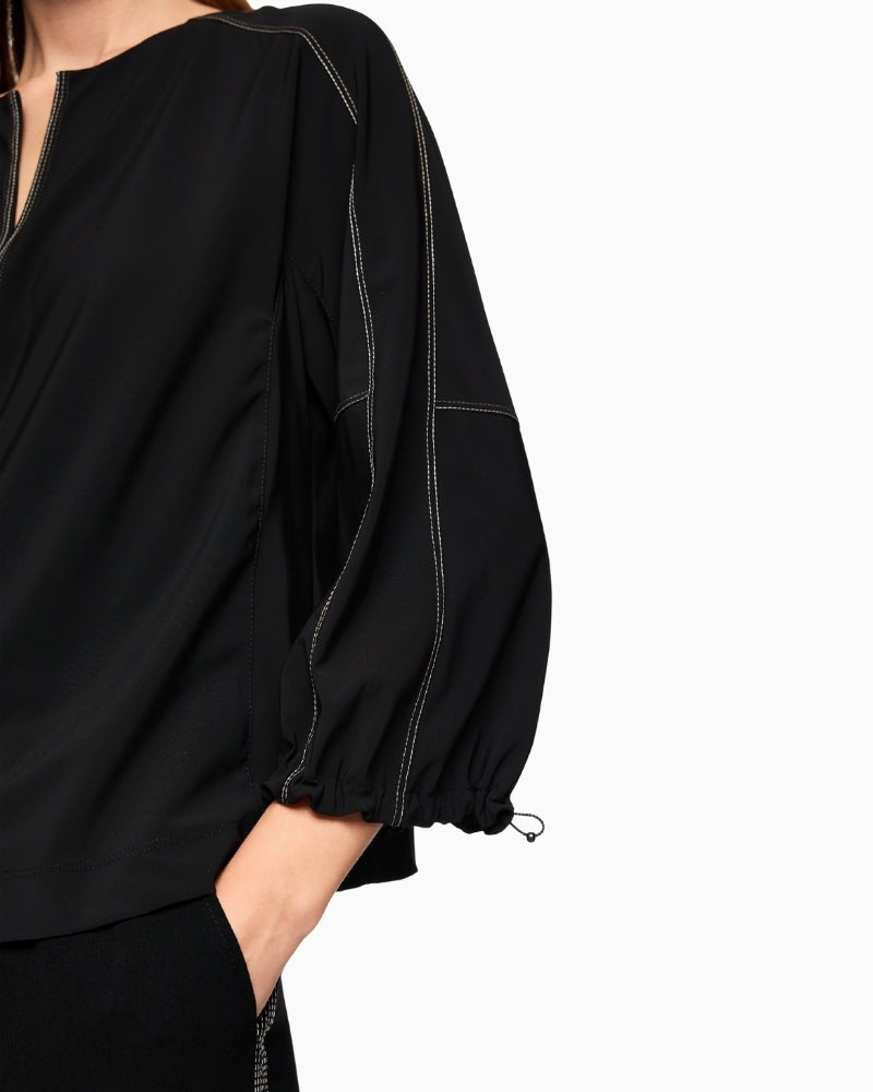 Close-up of soft stretch fabric in polyamide blend with V-neck cut