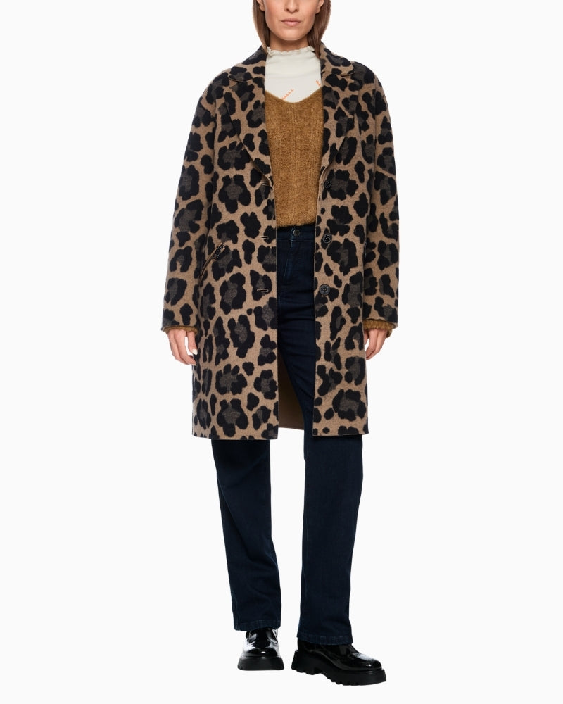 Marc Cain leopard print coat styled over black trousers for a bold winter look