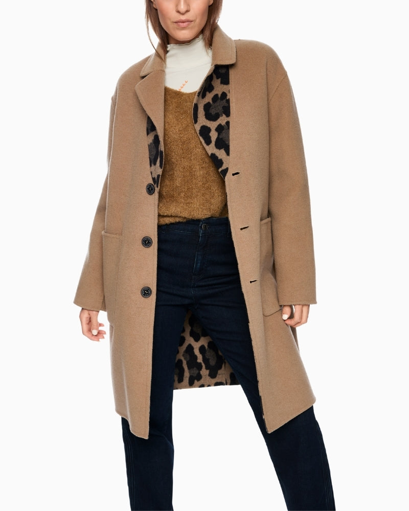 Front view of Marc Cain reversible coat with leopard print and button fastening
