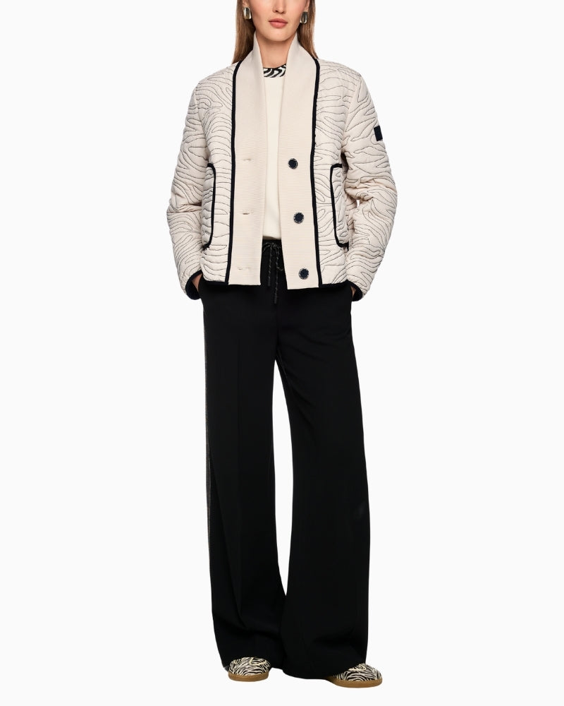 Cream jacket by Marc Cain styled with jeans for smart casual look