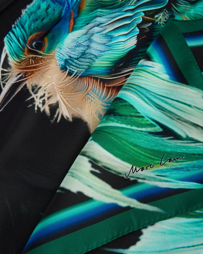 Detailed feather design on Marc Cain silk scarf with subtle logo lettering