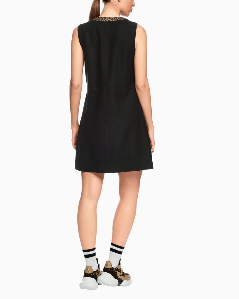 Back view showing straight fit and sporty zip detail on wool dress