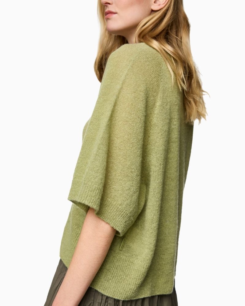 Side view of lightweight wool-blend jumper with round neckline and textured knit