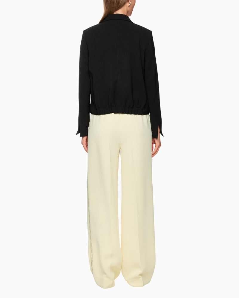 Back of Marc Cain blazer showing elasticated waistband detail