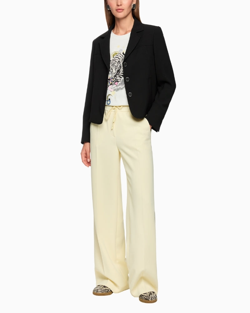 Black cropped blazer by Marc Cain styled with casual trousers