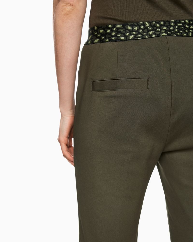 Close up of Marc Cain SYDNEY trousers in olive with stitched crease and cropped leg