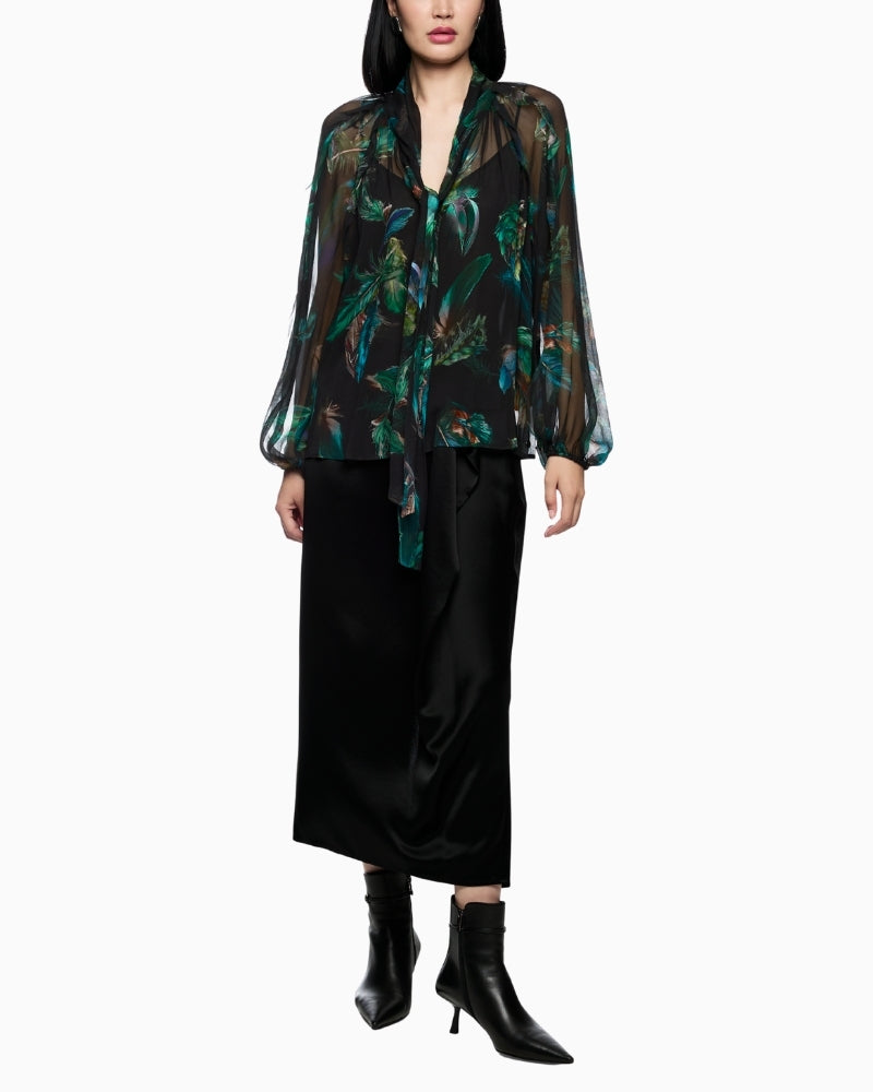 Sheer feather-print blouse by Marc Cain with bow tie neckline and loose fit