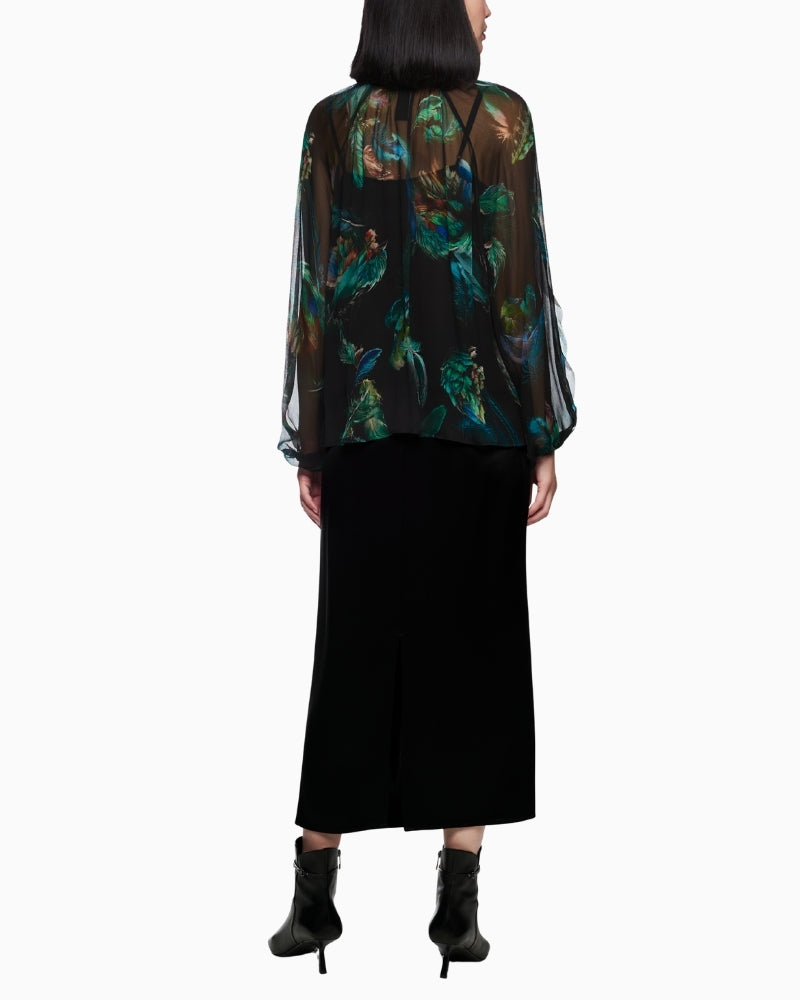 Back view of transparent Marc Cain blouse with soft feather pattern and elasticated cuffs