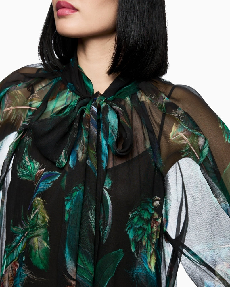 Close-up of feminine bow detail on Marc Cain’s airy viscose blouse