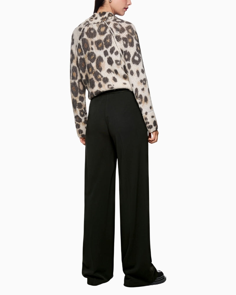 Back view of tailored viscose trousers with clean finish and fluid fit