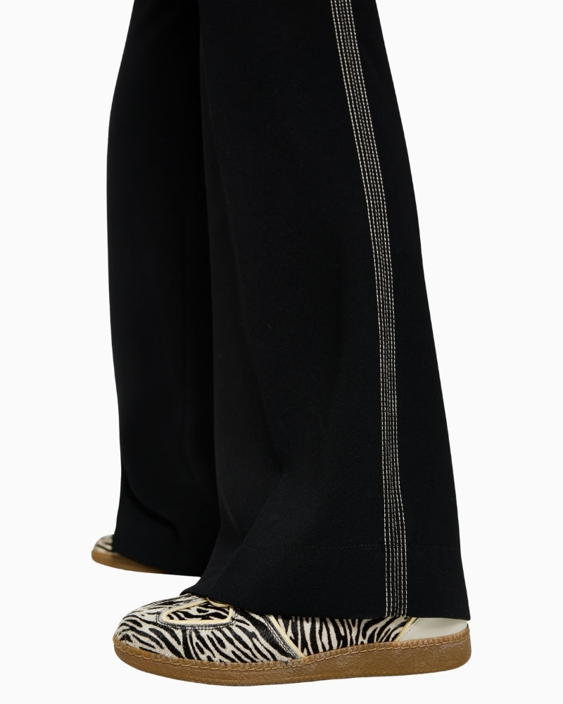 Close-up of elasticated waistband with drawstring on Marc Cain trousers