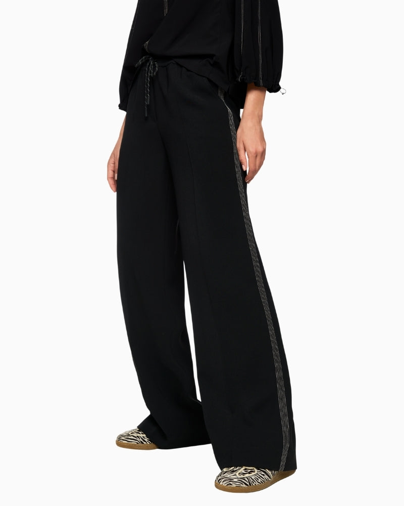 Elegant flowy trousers in black by Marc Cain with extra length and side pockets