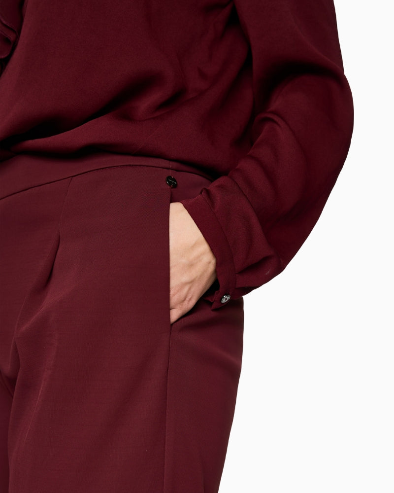 Close-up of waistband and button fastening on Marc Cain WICHITA pants