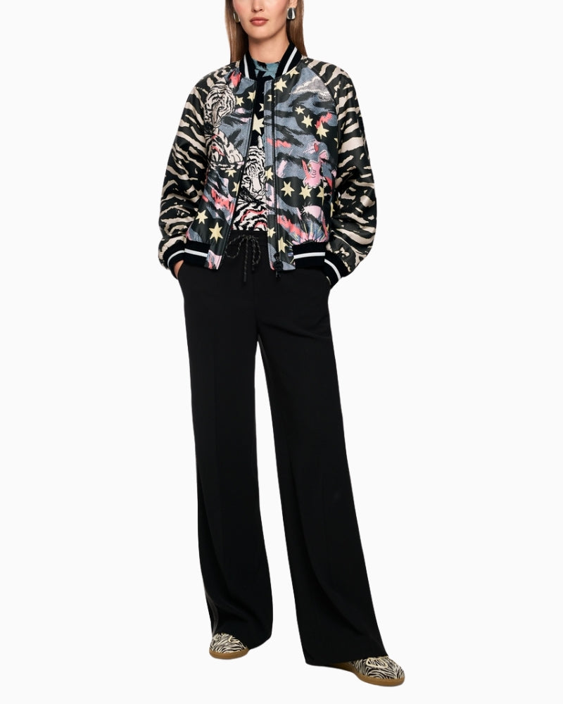 Marc Cain blouson jacket with comic print black model wearing jacket full length – Áines Boutique