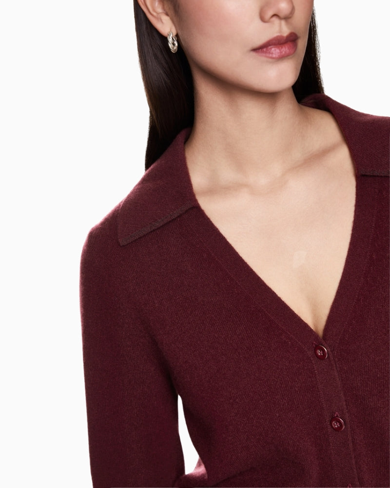 Detail of soft cashmere knit texture in rich maroon hue