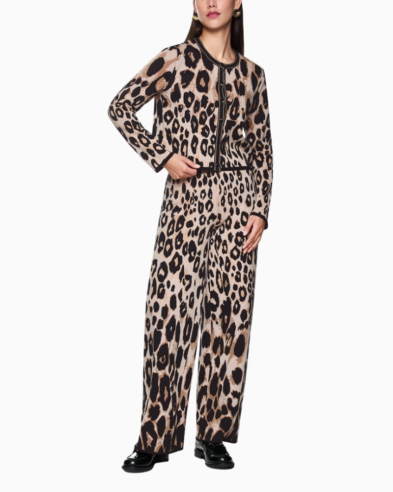 Model wearing Marc Cain leopard knit with coordinated trousers for casual styling