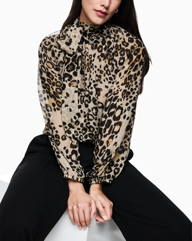 Light brown leopard blouse styled with black trousers