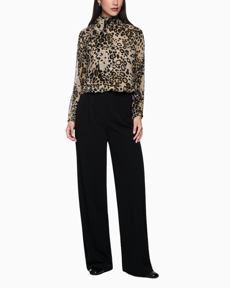 Day-to-night styling with leopard print semi-sheer blouse