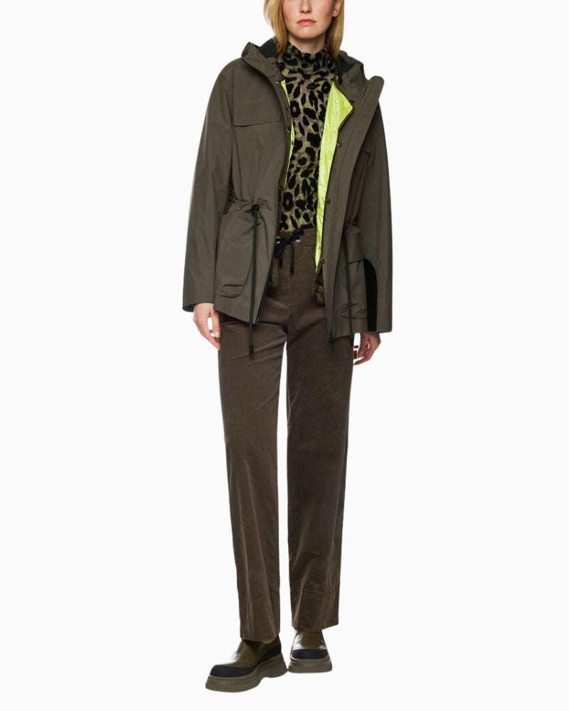 Model wearing drawstring jacket with hood