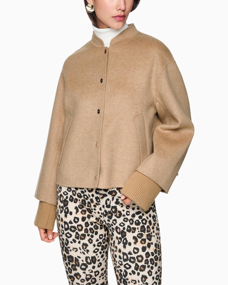 Model wearing Marc Cain oversized sand jacket, front view with press studs fastened