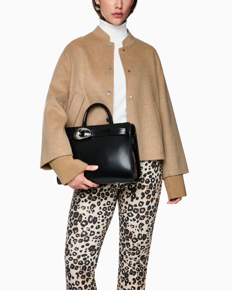 Side profile of jacket highlighting soft wool texture and oversized silhouette