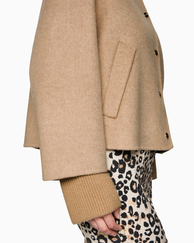Side profile of jacket highlighting soft wool texture and oversized silhouette