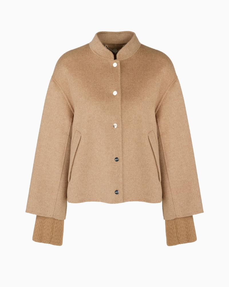 Flat lay of Marc Cain sand jacket showing press stud closure and collar shape