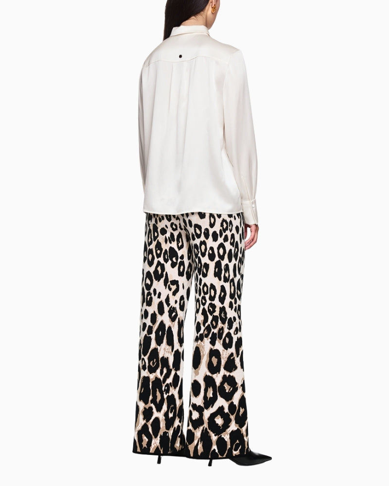 Back view of classic white silk blouse with cuffed sleeves