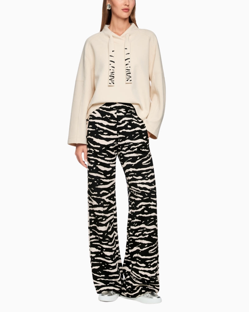 Marc Cain WELKOM wide-leg trousers with animal print black styling shot with top – Áines Boutique