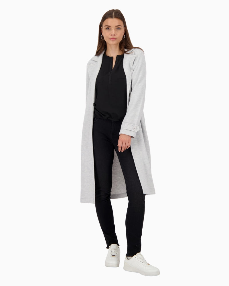 Monari blouse styled with tailored trousers for an elegant everyday look