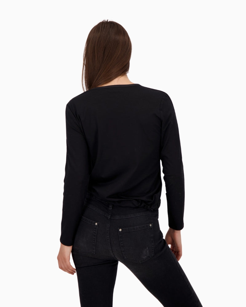 back view showing sleeve stripe and relaxed drawstring hem