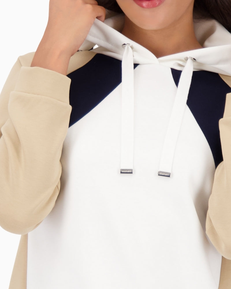 Close-up of fabric blend and colourblock pattern on Monari hoodie