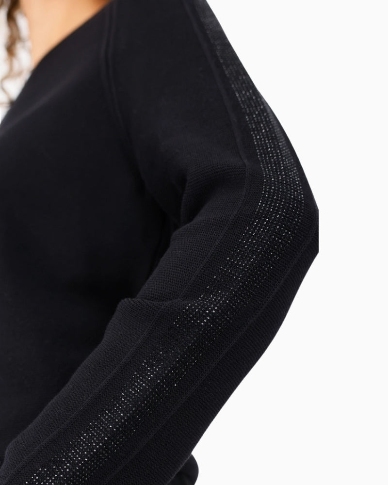 Close-up of sleeve showing rhinestone accents on elegant Monari jumper