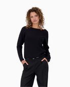 Front view of black cotton Monari sweater with round neckline and rhinestone sleeve detail