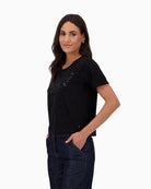 Side view of Black cotton T-shirt by Monari with eagle print and pearl detail