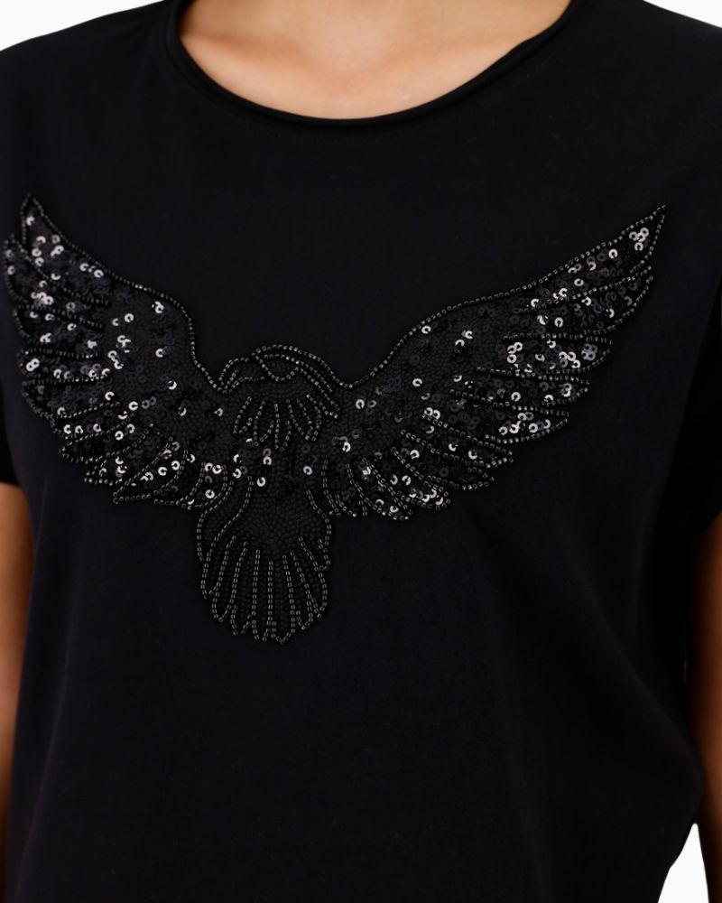 Close-up of Monari tee showing sequin embellishment and soft fabric